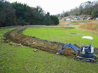 Culvert of rice field by backhoe digging